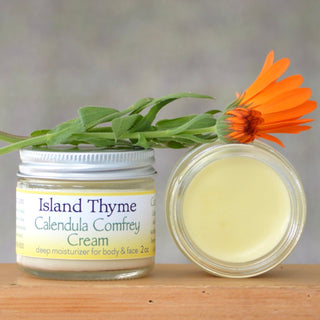 jar of calendula comfrey cream with calendula flower