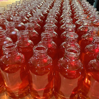 filled jars of aches & pains oil