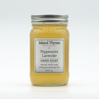 A 16 fl. oz. glass jar of Lavender Peppermint Castile Soap with a silver lid, made from organic castile soap and pure essential oils.