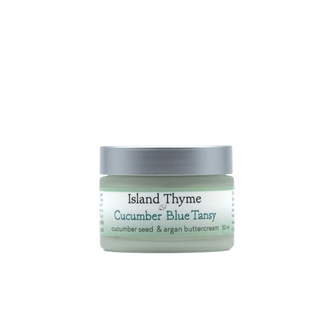 A small light green jar with a silver lid labeled Cucumber Blue Tansy Buttercream, 50 ml—an ideal night cream for dry skin—is shown against a plain white background.